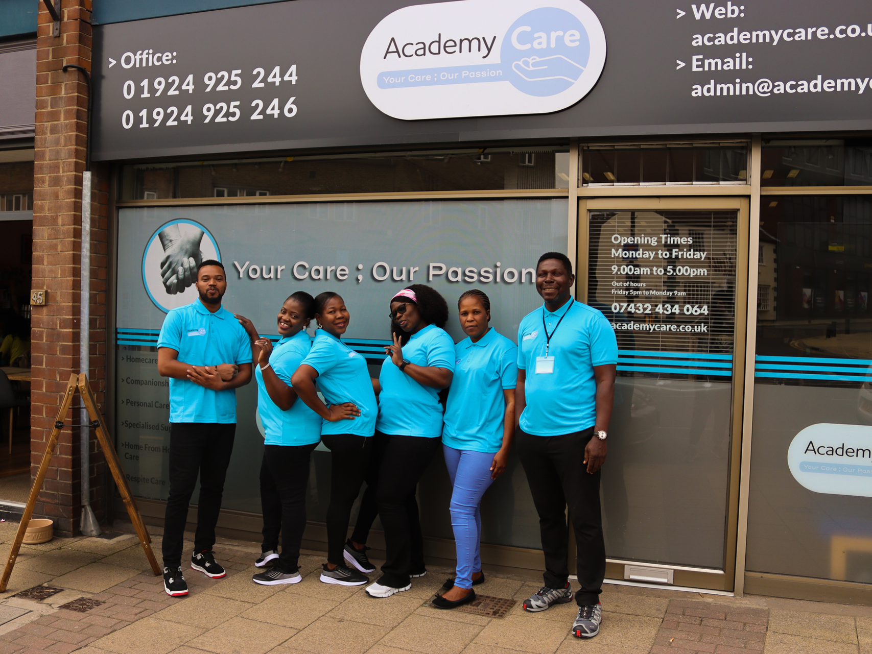 Six members of Academy Care staff, posing in front of the Wakefield Office